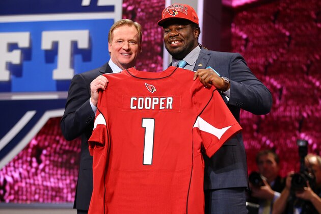 NEW YORK, NY - APRIL 25:  Jonathan Cooper of North Carolina Tar Heels stands with NFL Commissioner Roger Goodell (L) as they hold up a jersey on stage after Cooper was picked #7 overall by the Arizona Cardinals in the first round of the 2013 NFL Draft at Radio City Music Hall on April 25, 2013 in New York City.  (Photo by Al Bello/Getty Images)