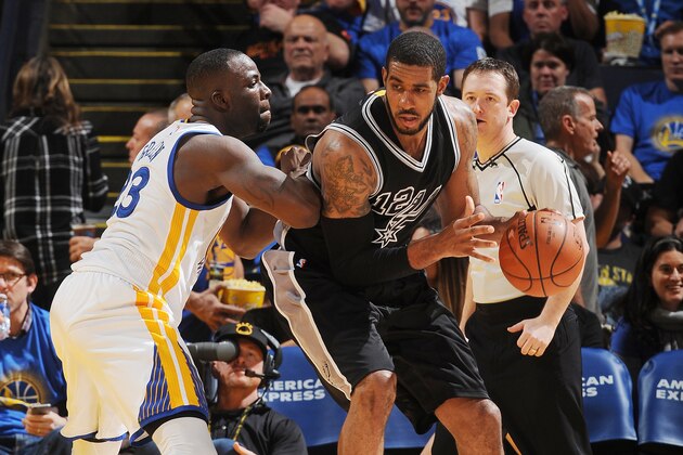 OAKLAND, CA - JANUARY 25: LaMarcus Aldridge #12 of the San Antonio Spurs posts against Draymond Green #23 of the Golden State Warriors on January 25, 2016 at Oracle Arena in Oakland, California. NOTE TO USER: User expressly acknowledges and agrees that, by downloading and or using this photograph, user is consenting to the terms and conditions of Getty Images License Agreement. Mandatory Copyright Notice: Copyright 2016 NBAE (Photo by Noah Graham/NBAE via Getty Images)