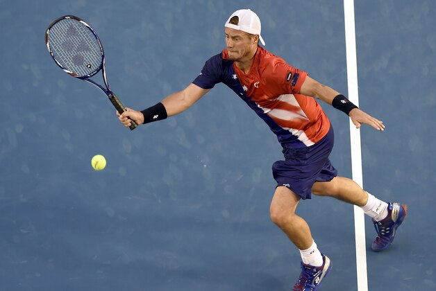 Lleyton Hewitt of Australia hits a forehand return to David Ferrer of Spain during their second round match at the Australian Open tennis championships in Melbourne, Australia, Thursday, Jan. 21, 2016.(AP Photo/Andrew Brownbill)
