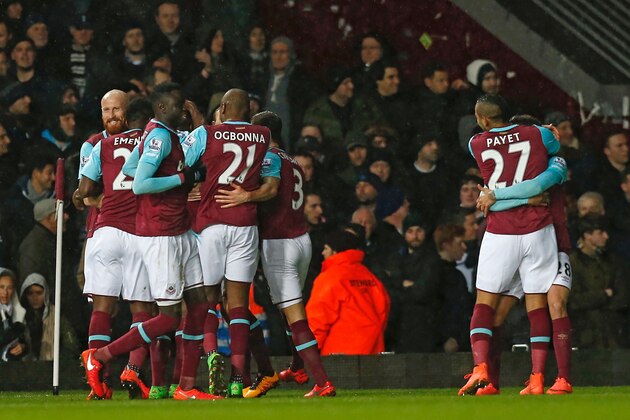 West Ham players celebrate Michail Antonio's opening goal during the English Premier League football match between West Ham United and Tottenham Hotpsur at The Boleyn Ground in Upton Park, in east London on March 2, 2016. / AFP / IAN KINGTON / RESTRICTED TO EDITORIAL USE. No use with unauthorized audio, video, data, fixture lists, club/league logos or 'live' services. Online in-match use limited to 75 images, no video emulation. No use in betting, games or single club/league/player publications.  /         (Photo credit should read IAN KINGTON/AFP/Getty Images)