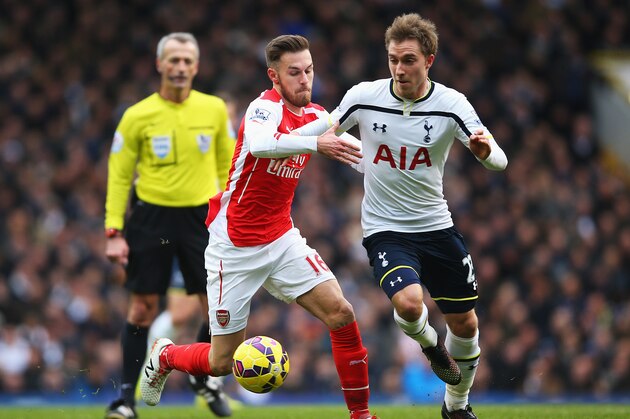 LONDON, ENGLAND - FEBRUARY 07:  Christian Eriksen of Tottenham Hotspur is challenged by Aaron Ramsey of Arsenal during the Barclays Premier League match between Tottenham Hotspur and Arsenal at White Hart Lane on February 7, 2015 in London, England.  (Photo by Paul Gilham/Getty Images)