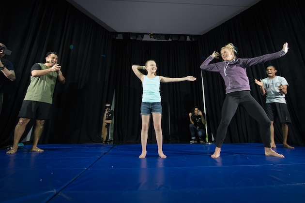LAS VEGAS, NV - MARCH 2:   UFC bantamweight champion Holly Holm brings a fan on stage and holds an open training session for fans and media at the  Jabbawockeez Theater in the MGM Grand Hotel/Casino on March 2, 2016 in Las Vegas, Nevada. (Photo by Brandon Magnus/Zuffa LLC/Zuffa LLC via Getty Images)