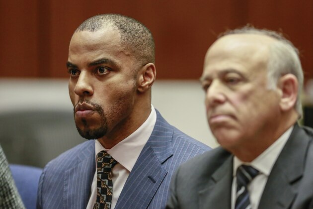 Former NFL safety Darren Sharper, left, with his attorney Leonard Levine appear in Los Angeles Superior Court on Monday, March 23, 2015. Sharper was sentenced to nine years in federal prison Monday immediately after he pleaded guilty to sexually assaulting a woman in Arizona, marking the first change of plea of the day for the former safety accused of drugging and assaulting women in four states. (AP Photo/Nick Ut, Pool)