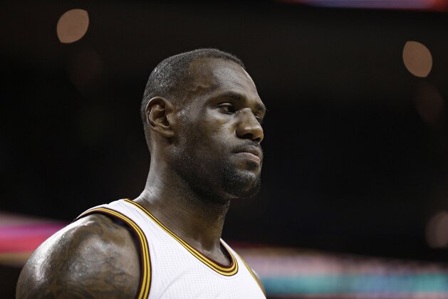 Cleveland Cavaliers' LeBron James waits for action to resume in the first half of an NBA basketball game against the Detroit Pistons, Monday, Feb. 22, 2016, in Cleveland. (AP Photo/Tony Dejak)