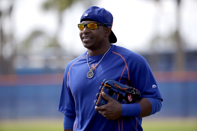 New York Mets' Yoenis Cespedes walks onto a field during spring training baseball practice Friday, Feb. 26, 2016, in Port St. Lucie, Fla. (AP Photo/Jeff Roberson)