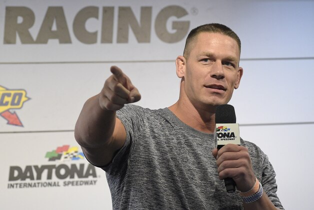 Professional wrestler John Cena answers question from the media during a news conference before the NASCAR Daytona 500 Sprint Cup Series auto race at Daytona International Speedway in Daytona Beach, Fla., Sunday, Feb. 21, 2016. (AP Photo/Phelan M. Ebenhack)