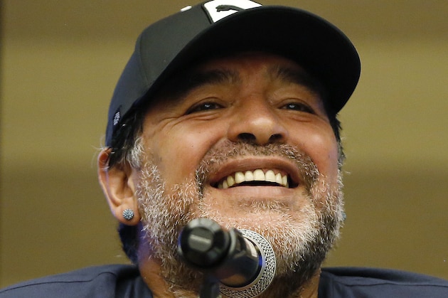 Argentina's soccer legend Diego Armando Maradona smiles during a press conference in Bogota, Colombia, Thursday, April 9, 2015. Maradona will play tomorrow in an exhibition soccer match in support of peace talks between the Colombian government and legist rebels. (AP Photo/Fernando Vergara)