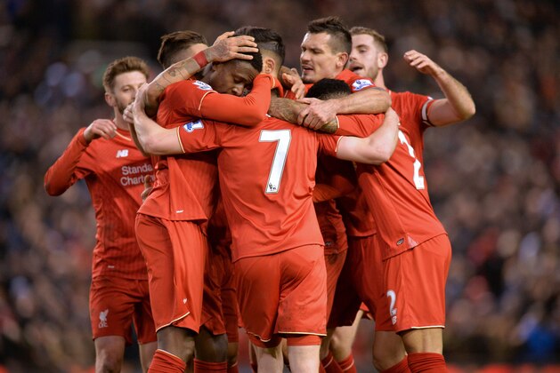 English midfielder James Milner celebrates with teammates after scoring their second goal during the English Premier League football match between Liverpool and Manchester City at Anfield in Liverpool, north west England on March 2, 2016. / AFP / Paul ELLIS / RESTRICTED TO EDITORIAL USE. No use with unauthorized audio, video, data, fixture lists, club/league logos or 'live' services. Online in-match use limited to 75 images, no video emulation. No use in betting, games or single club/league/player publications.  /         (Photo credit should read PAUL ELLIS/AFP/Getty Images)