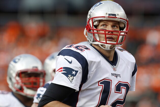 New England Patriots quarterback Tom Brady looks at the scoreboard as he runs off the field during the first half of the NFL football AFC Championship game between the Denver Broncos and the New England Patriots, Sunday, Jan. 24, 2016, in Denver. (AP Photo/Joe Mahoney)