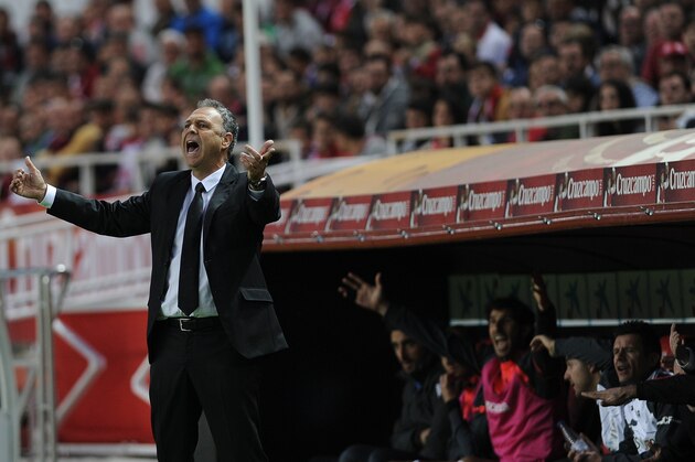 Granada's coach Joaquin Caparros (L) reacts during the Spanish league football match Sevilla FC vs Granada FC at the Ramon Sanchez Pizjuan stadium in Sevilla on November 30, 2014. Sevilla won the match 5-1.  AFP PHOTO/ CRISTINA QUICLER        (Photo credit should read CRISTINA QUICLER/AFP/Getty Images)