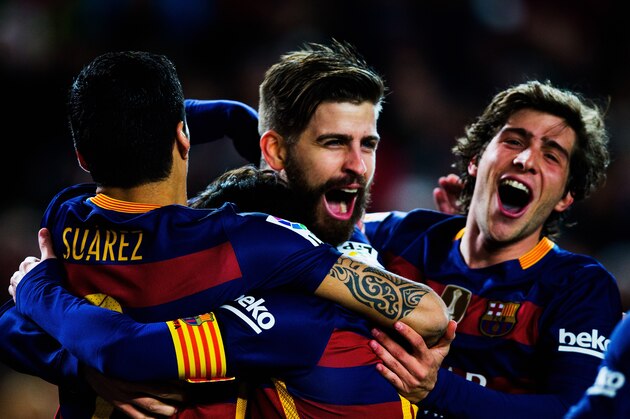 BARCELONA, SPAIN - FEBRUARY 28:  Gerard Pique of Barcelona is celebrated by his team after scoring his team's second goal during the La Liga match between FC Barcelona and Sevilla FC at Camp Nou on February 28, 2016 in Barcelona, Spain.  (Photo by Vladimir Rys Photography via Getty Images)