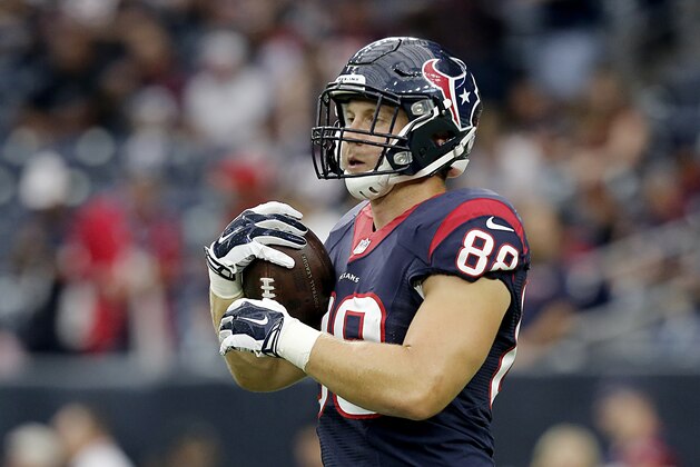 HOUSTON, TX - SEPTEMBER 27: Garrett Graham #88 of the Houston Texans holds teh ball during pre-game warm up before playing against the Tampa Bay Buccaneers on September 27, 2015 at NRG Stadium in Houston, Texas. (Photo by Thomas B. Shea/Getty Images)