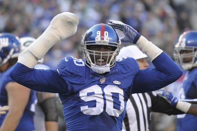 FILE - In this Dec. 6, 2015, file photo, New York Giants defensive end Jason Pierre-Paul reacts during the Giants' NFL football game against the New York Jets in East Rutherford, N.J. Pierre-Paul has filed a lawsuit seeking in more than $15,000 in damages against ESPN and reporter Adam Schefter for posting his medical records. The lawsuit, filed Wednesday, Feb. 24, 2016, in Miami Dade County in Florida, alleges that Pierre-Paul's privacy was violated–as was Florida's medical records statute–by the report last summer after the player severely injured his right hand in a fireworks accident on July 4. (AP Photo/Bill Kostroun)