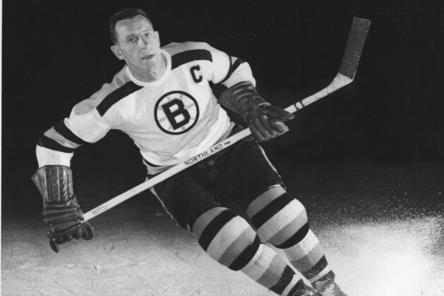 Milt Schmidt, captain of the Boston Bruins, is shown in an action pose in Sept. 1953.  (AP Photo)