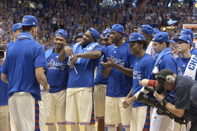 Feb 27, 2016; Lawrence, KS, USA; Kansas Jayhawks players celebrate after defeating the Texas Tech Red Raiders 67-58 winning their twelfth consecutive Big 12 titles at Allen Fieldhouse. Mandatory Credit: Denny Medley-USA TODAY Sports
