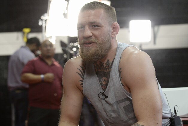 TORRENCE, CA - FEBRUARY 24:  UFC featherweight champion Conor McGregor speaks during an interview after a news conference with lightweight contender Nate Diaz at UFC Gym February 24, 2016, in Torrance, California. (Photo by Kevork Djansezian/Getty Images)