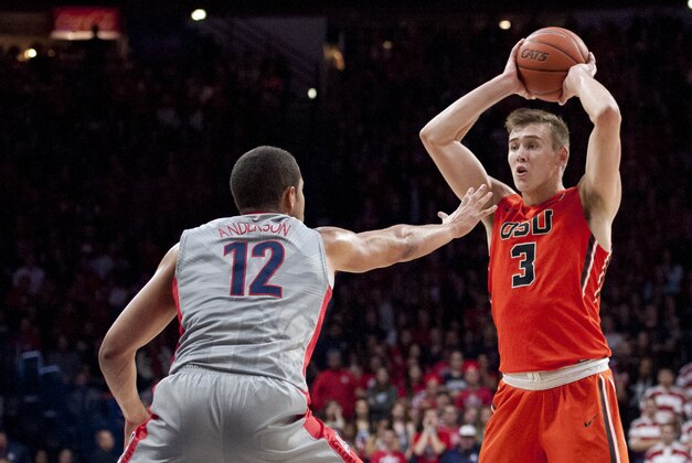 Jan 30, 2016; Tucson, AZ, USA; Oregon State Beavers forward Tres Tinkle (3) looks to pass as Arizona Wildcats forward Ryan Anderson (12) defends during the first half at McKale Center. Arizona won 80-63. Mandatory Credit: Casey Sapio-USA TODAY Sports