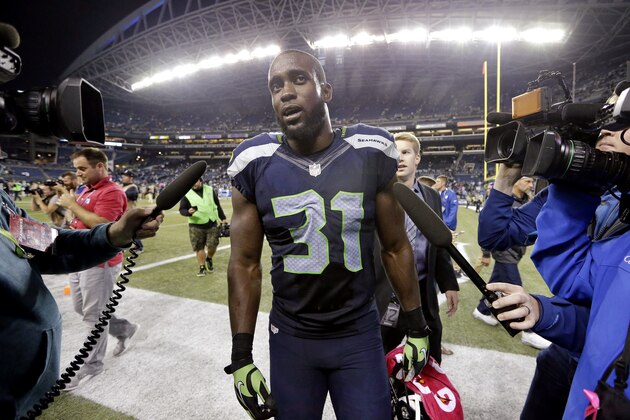 Seattle Seahawks strong safety Kam Chancellor walks off the field after the Seahawks beat the Detroit Lions 13-10 in an NFL football game, Monday, Oct. 5, 2015, in Seattle. (AP Photo/Elaine Thompson)