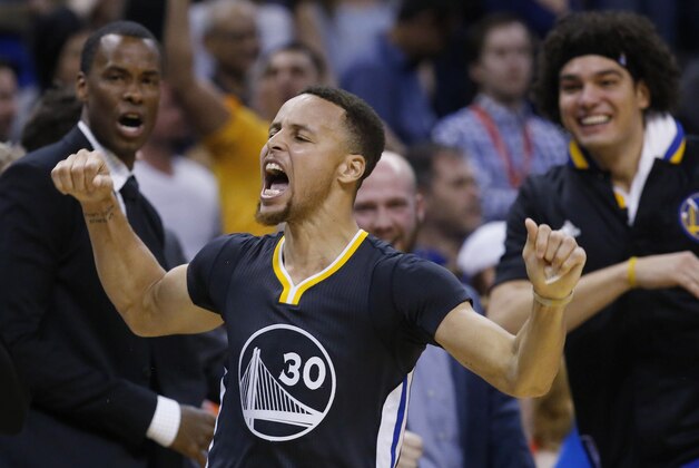Golden State Warriors guard Stephen Curry (30) celebrates after hitting the game-winning shot in overtime of an NBA basketball game against the Oklahoma City Thunder in Oklahoma City, Saturday, Feb. 27, 2016. Golden State won 121-118. (AP Photo/Sue Ogrocki)