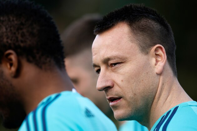 Chelsea's English defender John Terry (R) walks to the football pitches to take part in a training session at the club's complex in Cobham, Surrey on February 15, 2016.
Chelsea play Paris St-Germain in the last-16 round of matches in the Champions League on February 16, 2016. / AFP / ADRIAN DENNIS        (Photo credit should read ADRIAN DENNIS/AFP/Getty Images)