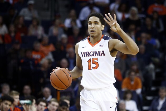 Virginia guard Malcolm Brogdon (15) signals a play during the first half of an NCAA college basketball game in Charlottesville, Va., on Friday, Nov. 13, 2015. Virginia won 86-48. (AP Photo/Ryan M. Kelly)