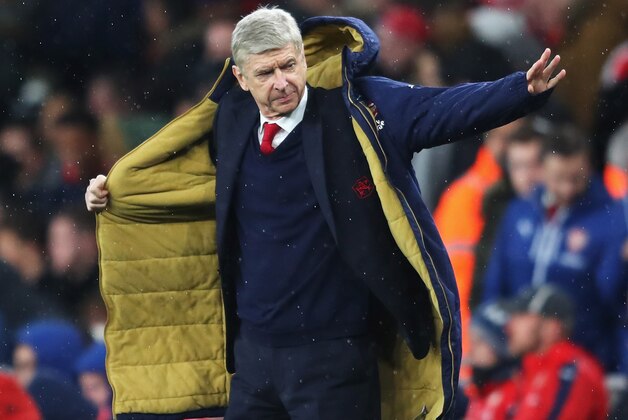 LONDON, ENGLAND - MARCH 02:  Arsene Wenger Manager of Arsenal puts on his coat during the Barclays Premier League match between Arsenal and Swansea City at the Emirates Stadium on March 2, 2016 in London, England.  (Photo by Richard Heathcote/Getty Images)