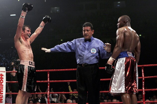 MANCHESTER, ENGLAND - MARCH 5:  Joe Calzaghe (L) celebrates his win against Jeff Lacy during the WBO and IBF super middleweight unification title fight at the MEN Arena on March 5, 2006 in Manchester, England. Calzaghe won the fight by unanimous decision to take the IBF super-middleweight title from Lacy and retain his WBO title.  (Photo by John Gichigi/Getty images)