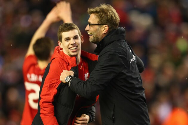LIVERPOOL, ENGLAND - JANUARY 26:  Jurgen Klopp manager of Liverpool and Jon Flanagan of Liverpool celebrate victory in the penalty shoot out after the Capital One Cup semi final second leg match between Liverpool and Stoke City at Anfield on January 26, 2016 in Liverpool, England. Liverpool win 6-5 on penalties after extra time.  (Photo by Clive Brunskill/Getty Images)