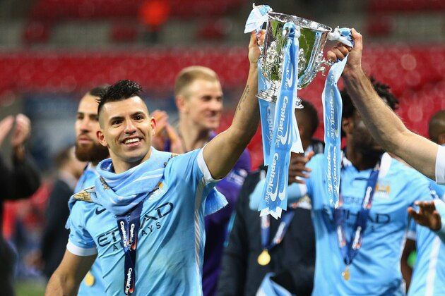 LONDON, ENGLAND - FEBRUARY 28:  Sergio Aguero of Manchester City and team mate Pablo Zabaleta celebrate victory with the trophy after the Capital One Cup Final match between Liverpool and Manchester City at Wembley Stadium on February 28, 2016 in London, England. Manchester City win 3-1 on penalties.  (Photo by Clive Brunskill/Getty Images)