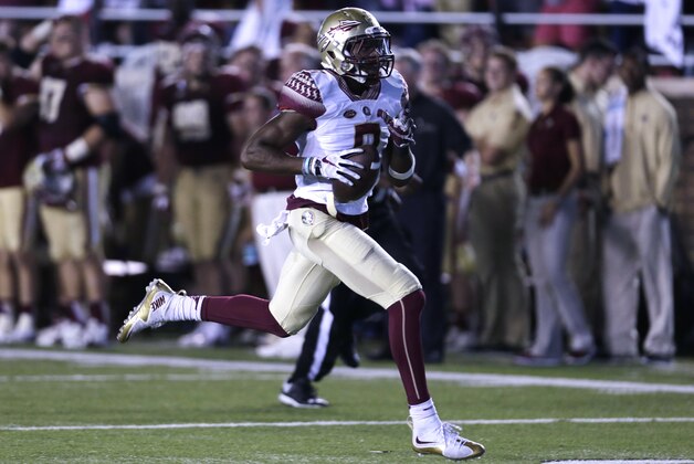 Florida State defensive back Jalen Ramsey (8) runs back the ball for a touchdown during the second half of an NCAA college football game in Boston, Friday, Sept. 18, 2015. (AP Photo/Charles Krupa)