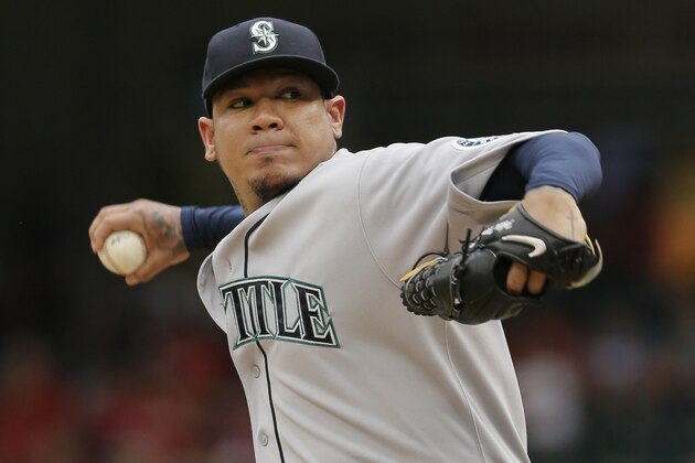 Seattle Mariners starting pitcher Felix Hernandez throws during the first inning of a baseball game against the Texas Rangers in Arlington, Texas, Sunday, Sept. 20, 2015. (AP Photo/LM Otero)