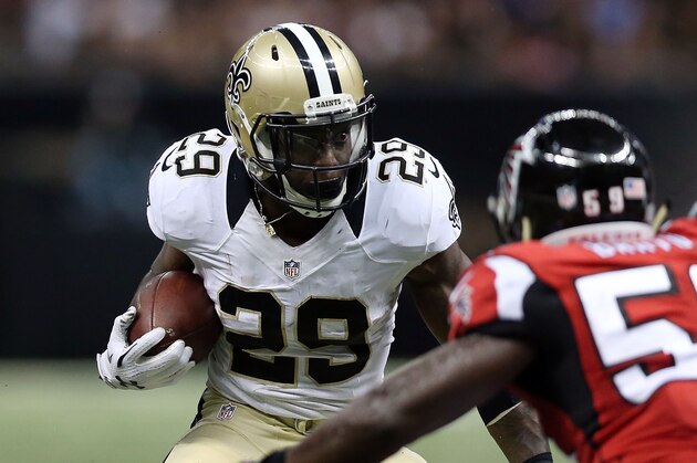NEW ORLEANS, LA - OCTOBER 15:  Khiry Robinson #29 of the New Orleans Saints is pursued by Joplo Bartu #59 of the Atlanta Falcons during the fourth quarter of a game at the Mercedes-Benz Superdome on October 15, 2015 in New Orleans, Louisiana.  (Photo by Chris Graythen/Getty Images)