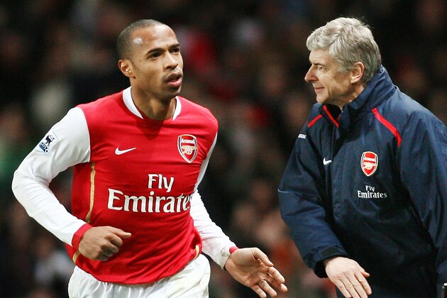 Arsenal's Thierry Henry (L) runs past Manager Arsene Wenger (R) while celebrating scoring the winning goal against Manchester United during the Premiership football match at The Emirates Stadium in London 21 January 2007. Arsenal won the game 2-1 after two late second half goals from Thierry Henry and Robin van Persie. AFP PHOTO ADRIAN DENNIS
(Photo credit should read ADRIAN DENNIS/AFP/Getty Images) Arsenal's Thierry Henry (L) runs past Manager Arsene Wenger (R) while celebrating scoring the winning goal against Manchester United during the Premiership football match at The Emirates Stadium in London 21 January 2007. Arsenal won the game 2-1 after two late second half goals from Thierry Henry and Robin van Persie. AFP PHOTO ADRIAN DENNIS
(Photo credit should read ADRIAN DENNIS/AFP/Getty Images)