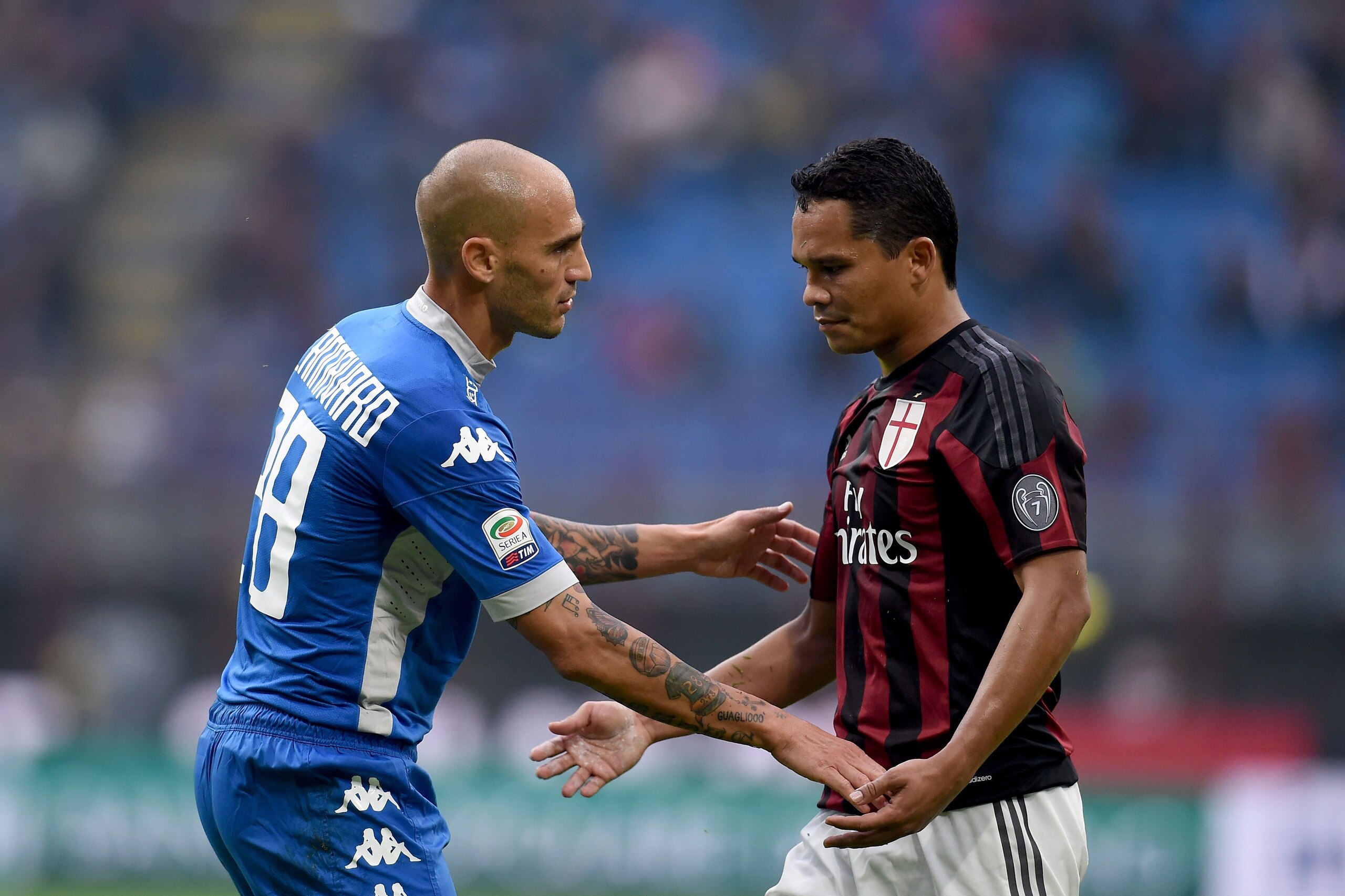 MILAN, ITALY - OCTOBER 25:  Carlos Bacca of AC Milan (R) and Paolo Cannavaro of US Sassuolo Calcio chat during the Serie A match between AC Milan and US Sassuolo Calcio at Stadio Giuseppe Meazza on October 25, 2015 in Milan, Italy.  (Photo by Claudio Villa/Getty Images)