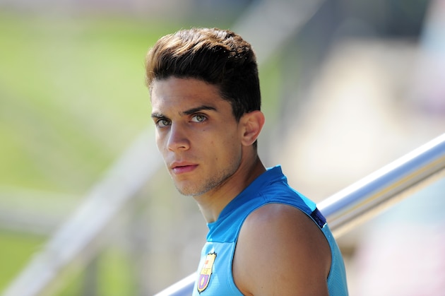 FC Barcelona's Marc Bartra pauses,  during a training session,  in San Joan Despi, Spain, Friday, May 16, 2014. Barcelona faces Spanish leader Atletico Madrid in a winner-takes-all league finale on Saturday, when the defending champion could yet lift its fifth title in six seasons. (AP Photo/Manu Fernandez)