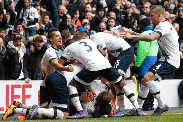 Tottenham Hotspur's English striker Harry Kane (C) celebrates with teammates after scoring their second goal during the English Premier League football match between Tottenham Hotspur and Arsenal at White Hart Lane in London, on March 5, 2016. / AFP / IKIMAGES / IKimages / RESTRICTED TO EDITORIAL USE. No use with unauthorized audio, video, data, fixture lists, club/league logos or 'live' services. Online in-match use limited to 45 images, no video emulation. No use in betting, games or single club/league/player publications.        (Photo credit should read IKIMAGES/AFP/Getty Images)