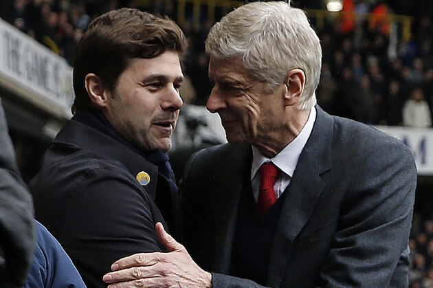 Tottenham Hotspur's Argentinian head coach Mauricio Pochettino (L) shakes hands with Arsenal's French manager Arsene Wenger ahead of the English Premier League football match between Tottenham Hotspur and Arsenal at White Hart Lane in London, on March 5, 2016.
The game finished 2-2. / AFP / Adrian DENNIS / RESTRICTED TO EDITORIAL USE. No use with unauthorized audio, video, data, fixture lists, club/league logos or 'live' services. Online in-match use limited to 75 images, no video emulation. No use in betting, games or single club/league/player publications.        (Photo credit should read ADRIAN DENNIS/AFP/Getty Images)