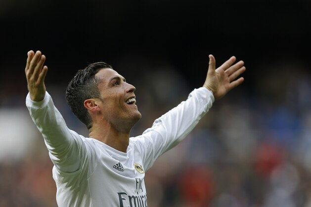 Real Madrid's Cristiano Ronaldo celebrates after scoring his side's third goal against Celta during a Spanish La Liga soccer match between Real Madrid and Celta Vigo at the Santiago Bernabeu stadium in Madrid, Saturday, March 5, 2016. (AP Photo/Francisco Seco)