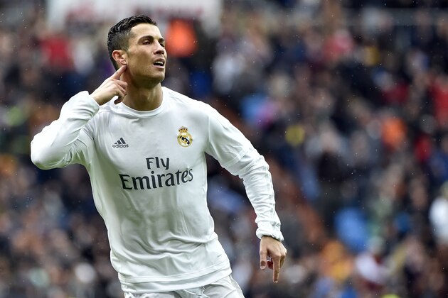 Real Madrid's Portuguese forward Cristiano Ronaldo gestures as he celebrates a goal during the Spanish league football match Real Madrid CF vs RC Celta de Vigo at the Santiago Bernabeu stadium in Madrid on March 5, 2016. / AFP / GERARD JULIEN        (Photo credit should read GERARD JULIEN/AFP/Getty Images)