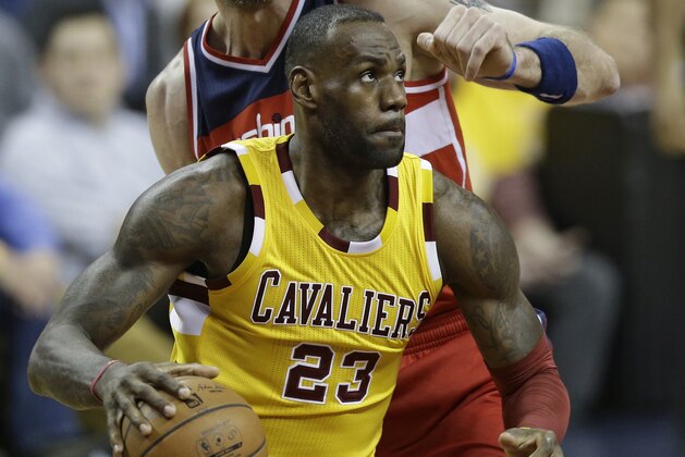 Cleveland Cavaliers' LeBron James (23) drives past Washington Wizards' Marcin Gortat (13), from Poland, in the first half of an NBA basketball game Friday, March 4, 2016, in Cleveland. (AP Photo/Tony Dejak)