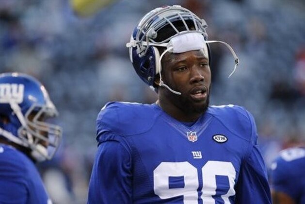FILE - In this Jan. 3, 2016, file photo, New York Giants defensive end Jason Pierre-Paul (90) warms up before playing against the Philadelphia Eagles in an NFL football game in East Rutherford, N.J. Ben McAdoo's first season as Giants head coach could turn on the recoveries of two key players, Jason Pierre-Paul and Victor Cruz. (AP Photo/Julio Cortez, File)