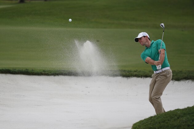 Rory McIlroy of Northern Ireland, hits from the sand on the 12th hole during the third round of the Cadillac Championship golf tournament, Saturday, March 5, 2016, in Doral, Fla. (AP Photo/Wilfredo Lee)