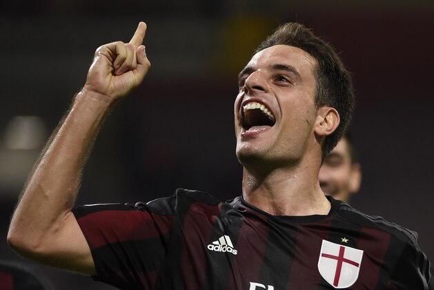 AC Milan's midfielder from Italy Giacomo Bonaventura celebrates after scoring during the Italian Serie A football match AC Milan vs Palermo on September 19, 2015 at the San Siro Stadium stadium in Milan. AFP PHOTO / OLIVIER MORIN        (Photo credit should read OLIVIER MORIN/AFP/Getty Images)