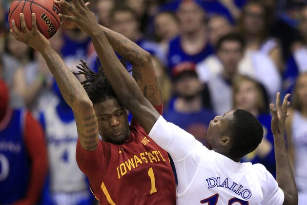 Iowa State forward Jameel McKay (1) rebounds against Kansas forward Cheick Diallo (13) during the first half of an NCAA college basketball game in Lawrence, Kan., Saturday, March 5, 2016. (AP Photo/Orlin Wagner)