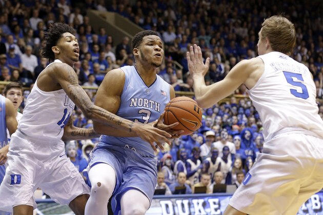North Carolina's Kennedy Meeks (3) is pressured by Duke's Brandon Ingram, left, and Luke Kennard (5) during the first half of an NCAA college basketball game in Durham, N.C., Saturday, March 5, 2016. (AP Photo/Gerry Broome)