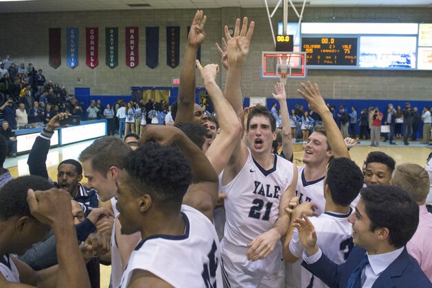 Yale guard Nick Victor (21) celebrates the win at the end of the second half of an NCAA Ivy League Conference college basketball game Saturday, March 5, 2016, in New York. Yale beat Columbia 71-55. (AP Photo/Bryan R. Smith)