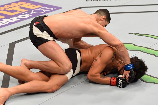 LAS VEGAS, NV - MARCH 05: Nordine Taleb of France (top) punches Erick Silva of Brazil in their welterweight bout during the UFC 196 event inside MGM Grand Garden Arena on March 5, 2016 in Las Vegas, Nevada.  (Photo by Josh Hedges/Zuffa LLC/Zuffa LLC via Getty Images)