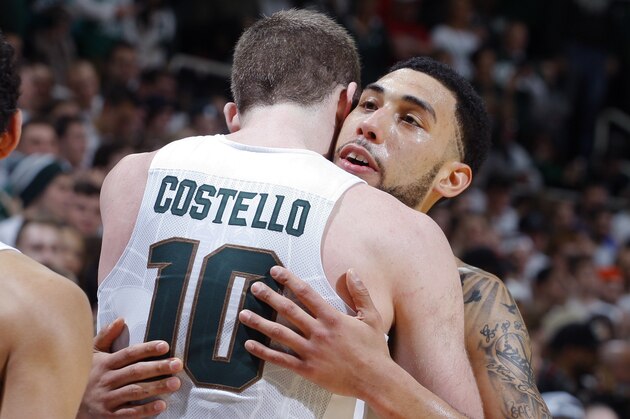 Michigan State's Denzel Valentine, right, and Matt Costello (10) embrace near the end of an NCAA college basketball game against Ohio State, Saturday, March 5, 2016, in East Lansing, Mich. Michigan State won 91-76. (AP Photo/Al Goldis)
