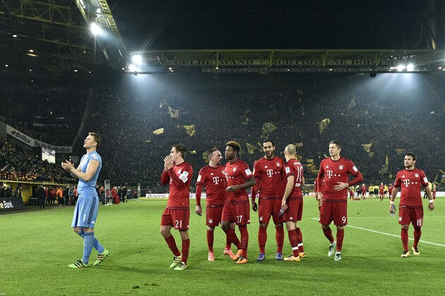 Bayern's team walk on the pitch disappointed  after the German Bundesliga soccer match between Borussia Dortmund and Bayern Munich, in Dortmund, Germany, Saturday, March 5, 2016. The match ended 0-0. (AP Photo/Martin Meissner)