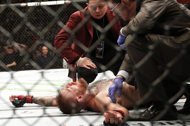 Conor McGregor recovers shortly after a second round-submission to Nate Diaz during their UFC 196 welterweight mixed martial arts match, Saturday, March 5, 2016, in Las Vegas. (AP Photo/Eric Jamison)